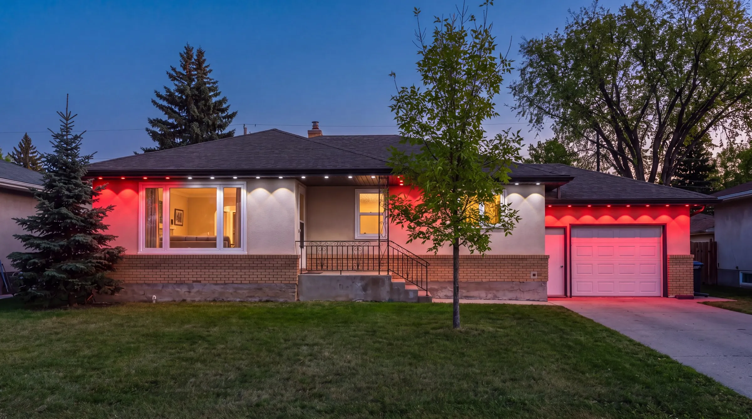 Winnipeg bungalow on a summer evening with Govee permanent lights in red and white for Canada Day