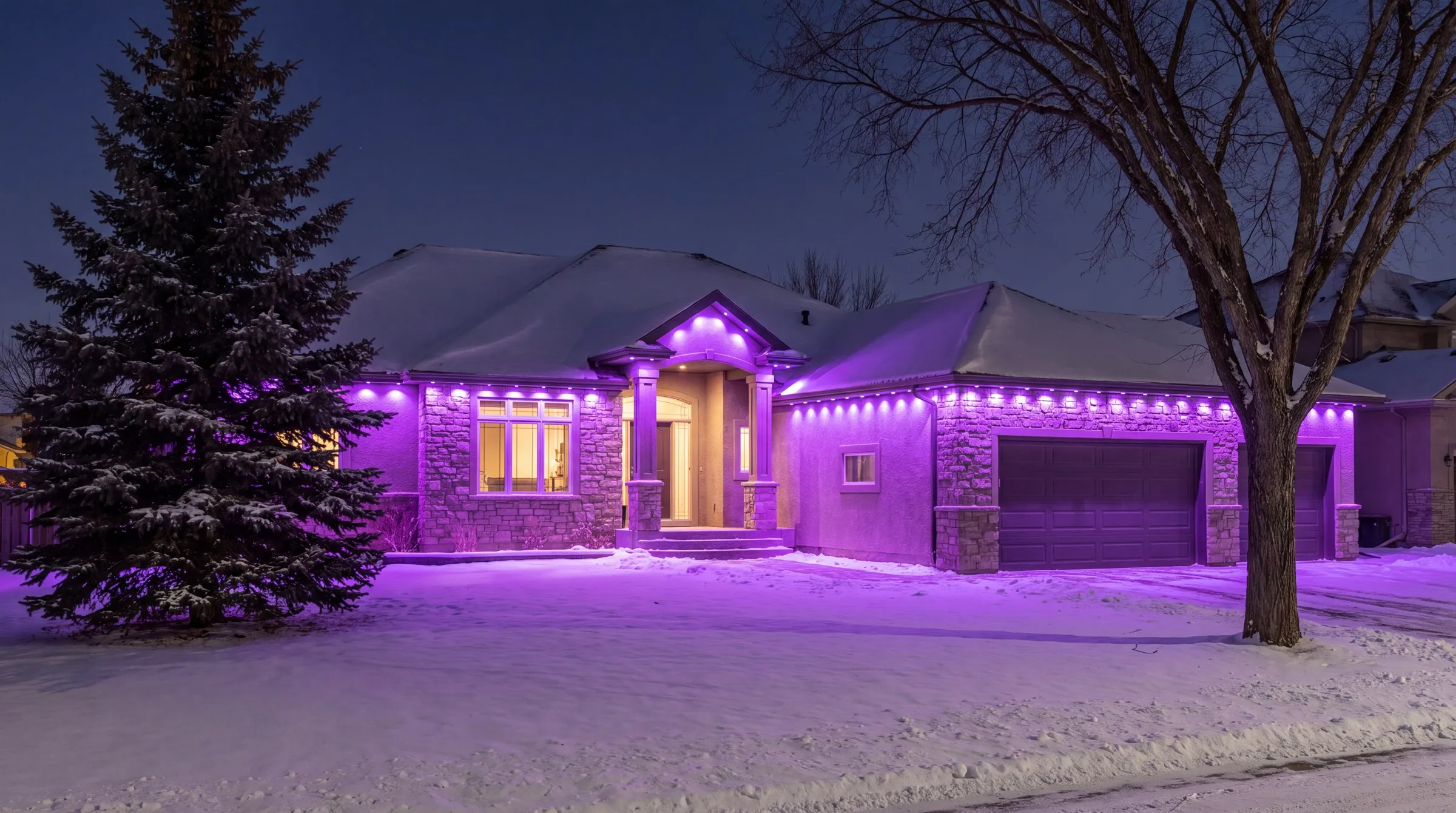 Winnipeg stone and stucco bungalow in snow at night with Govee permanent lights in purple along every eave