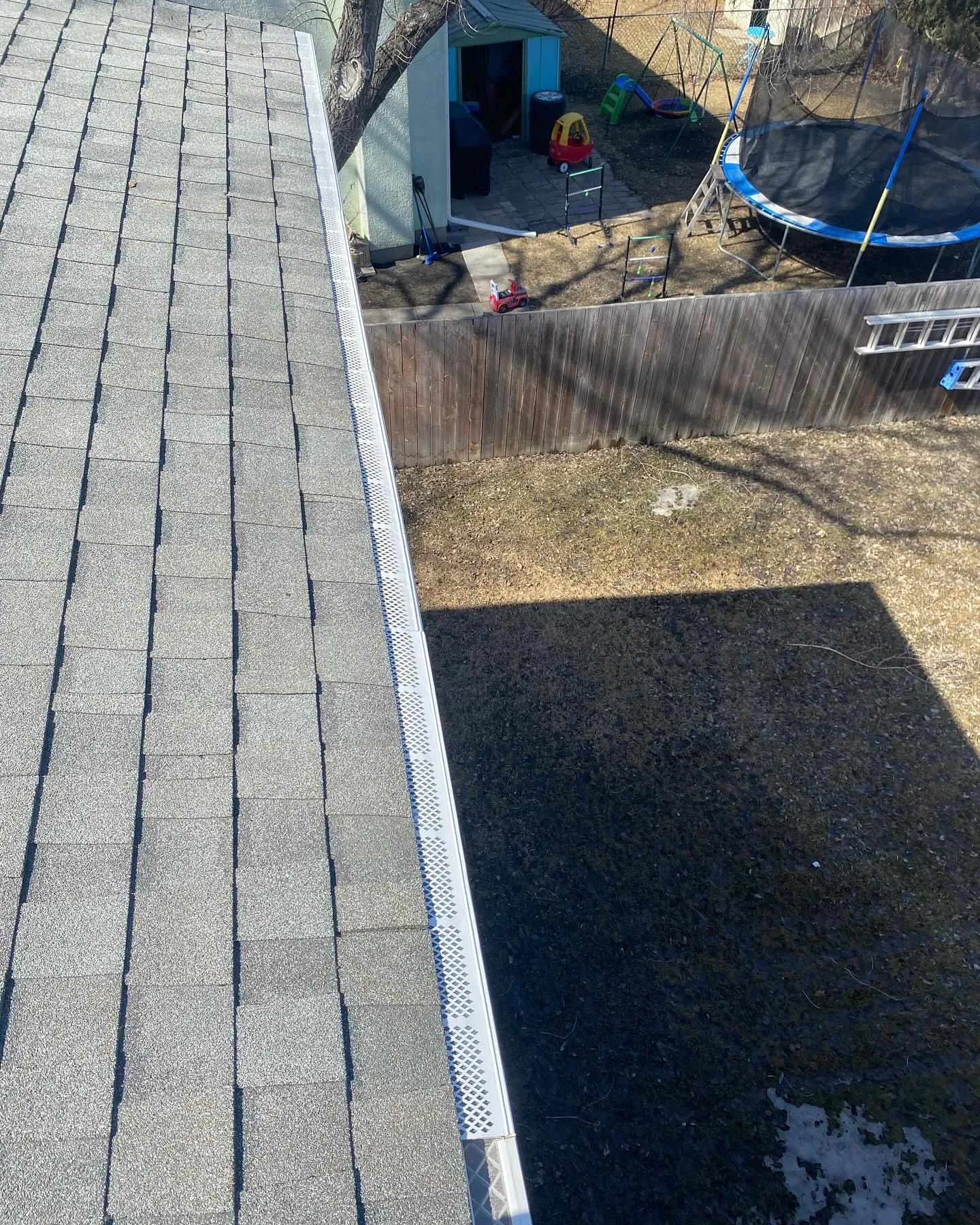 Close-up of a gutter guard fitted to an eavestrough on a Winnipeg home